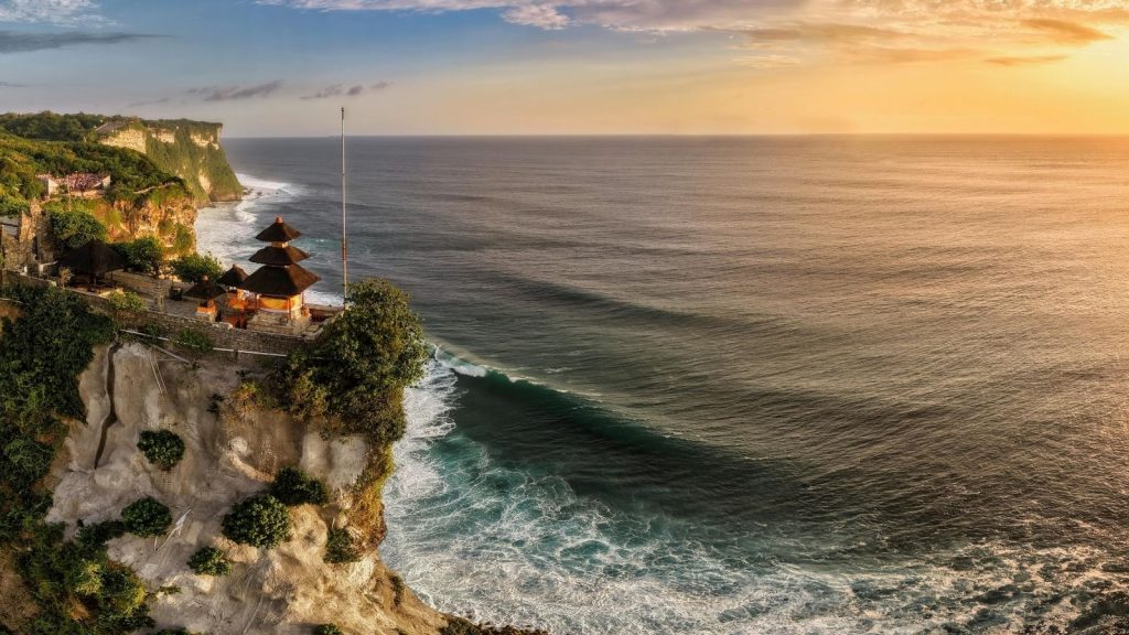 Uluwatu coastline and tropical beach at sunset in Bali