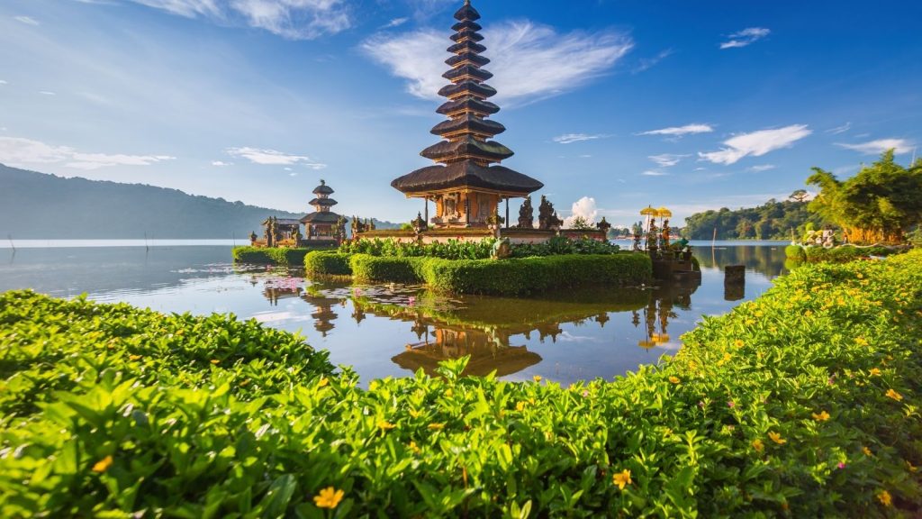 Ulun Danu Beratan Temple surrounded by mountains and water in Bali
