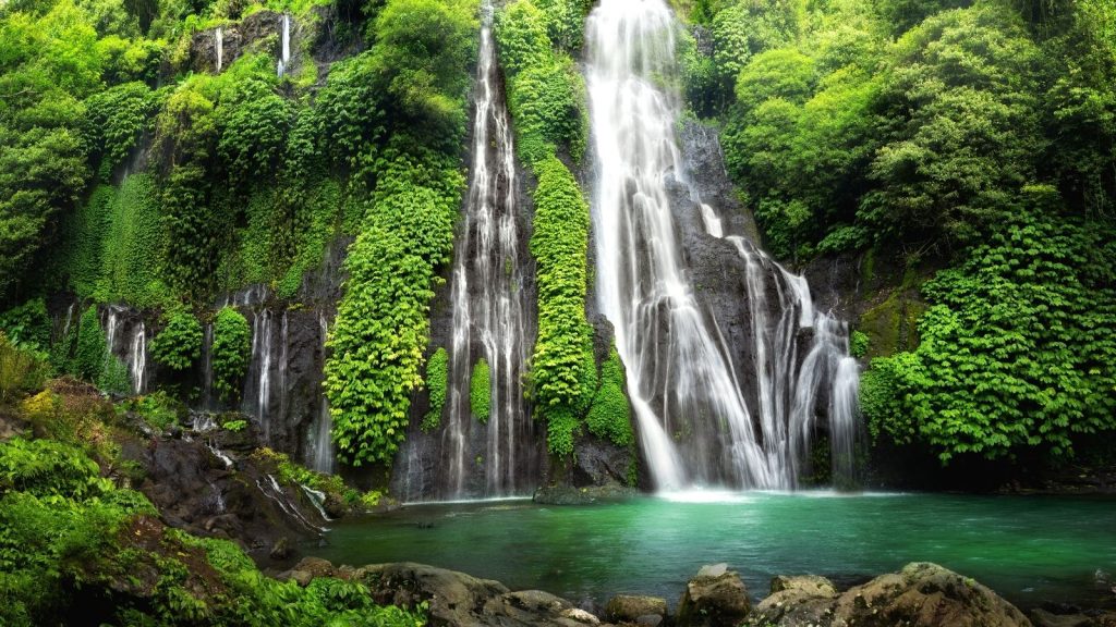 Tegenungan Waterfall surrounded by tropical forest near Ubud Bali