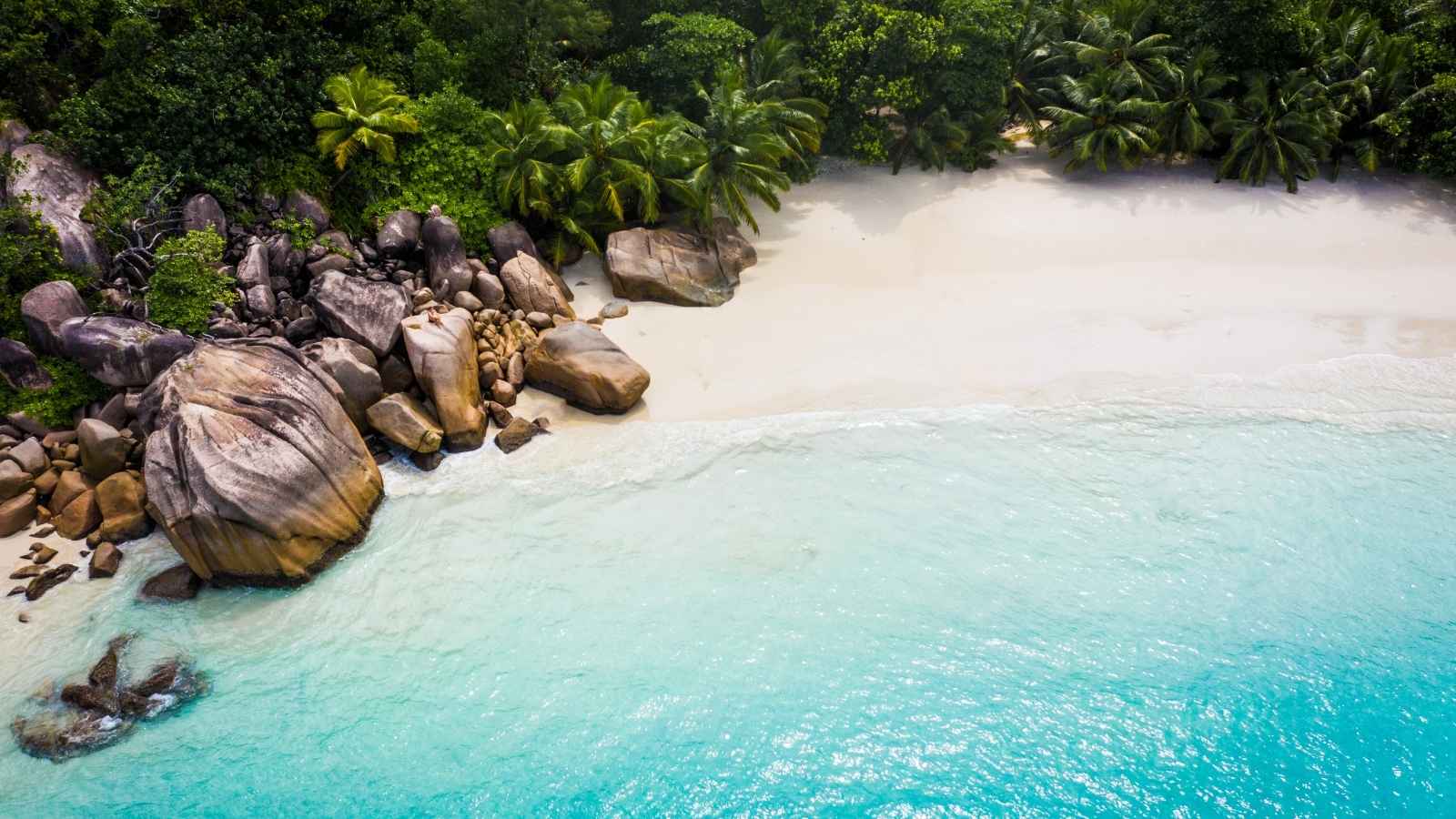 Tropical beach and turquoise lagoon on Praslin Island Seychelles